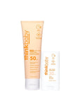 Two bottles of thinkbaby sunscreen on a white background