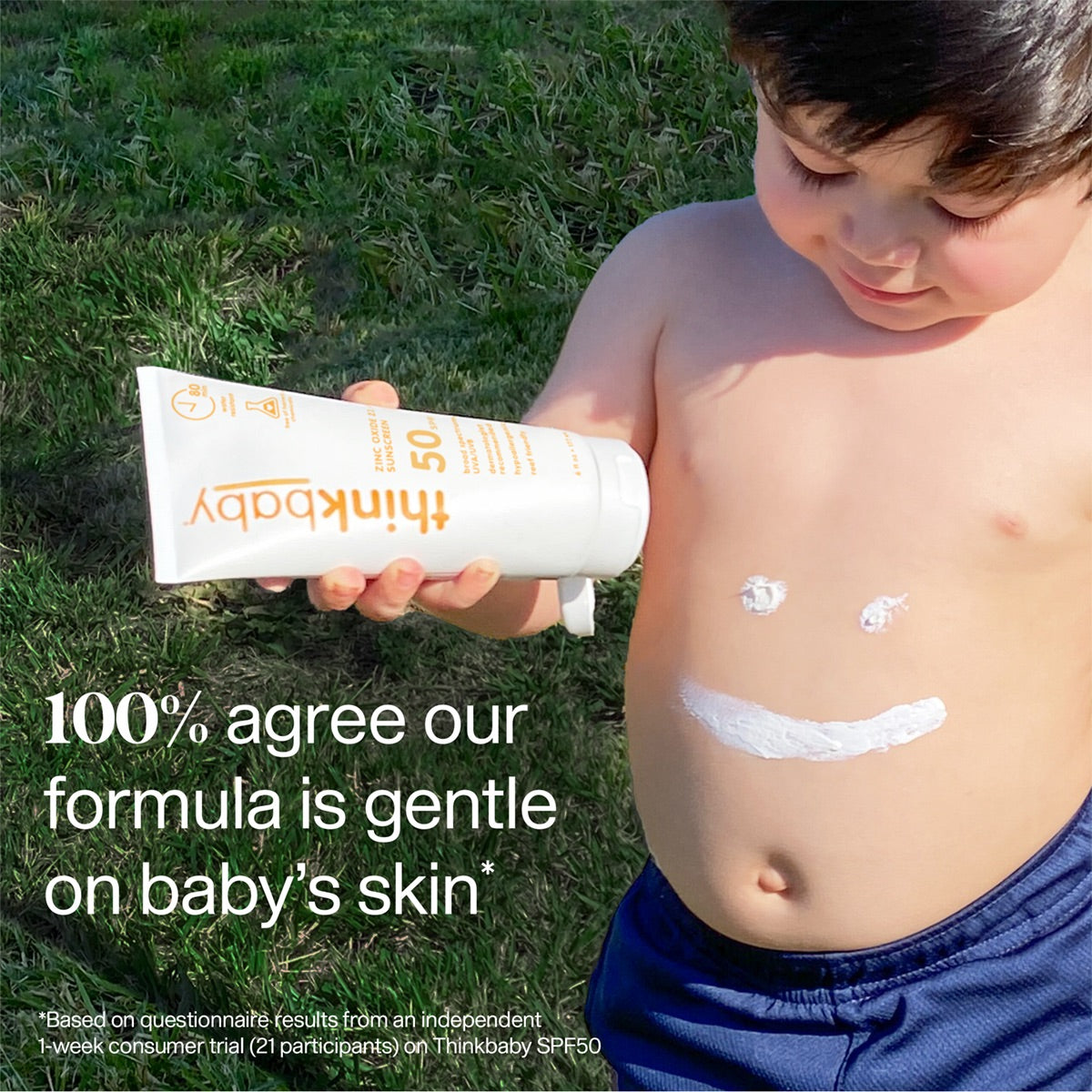 A young child is shown holding a tube of Thinkbaby SPF 50 sunscreen, with sunscreen applied in a smiley face pattern on the child's belly, accompanied by text saying '100% agree our formula is gentle on baby's skin.'