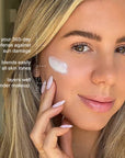 Woman applying sunscreen to her face with text highlighting its benefits