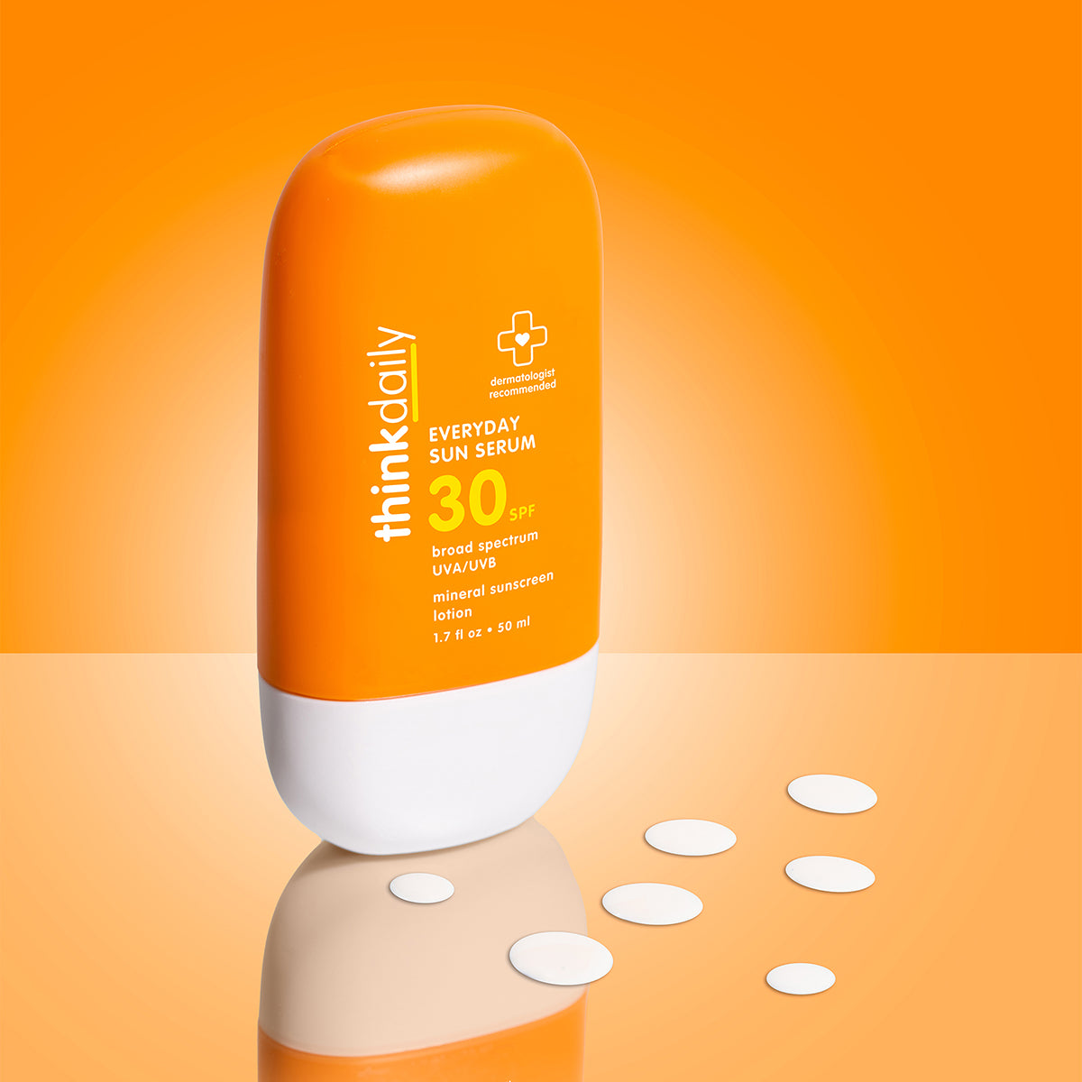 Orange sunscreen bottle labeled 'thinkdaily' on an orange background