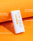 Flat lay image of Thinkbaby sunscreen stick with annotations for key features like dermatologist recommendation, mineral sunscreen, and a playful, natural scent.
